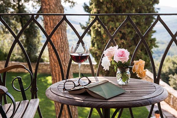Unwind with biodynamic wine and a good book on a terrace overlooking the rolling Tuscan countryside.