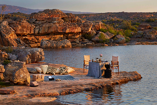 Enjoy a riverside sunset complete with a traditional South African meal at Bushmans Kloof.