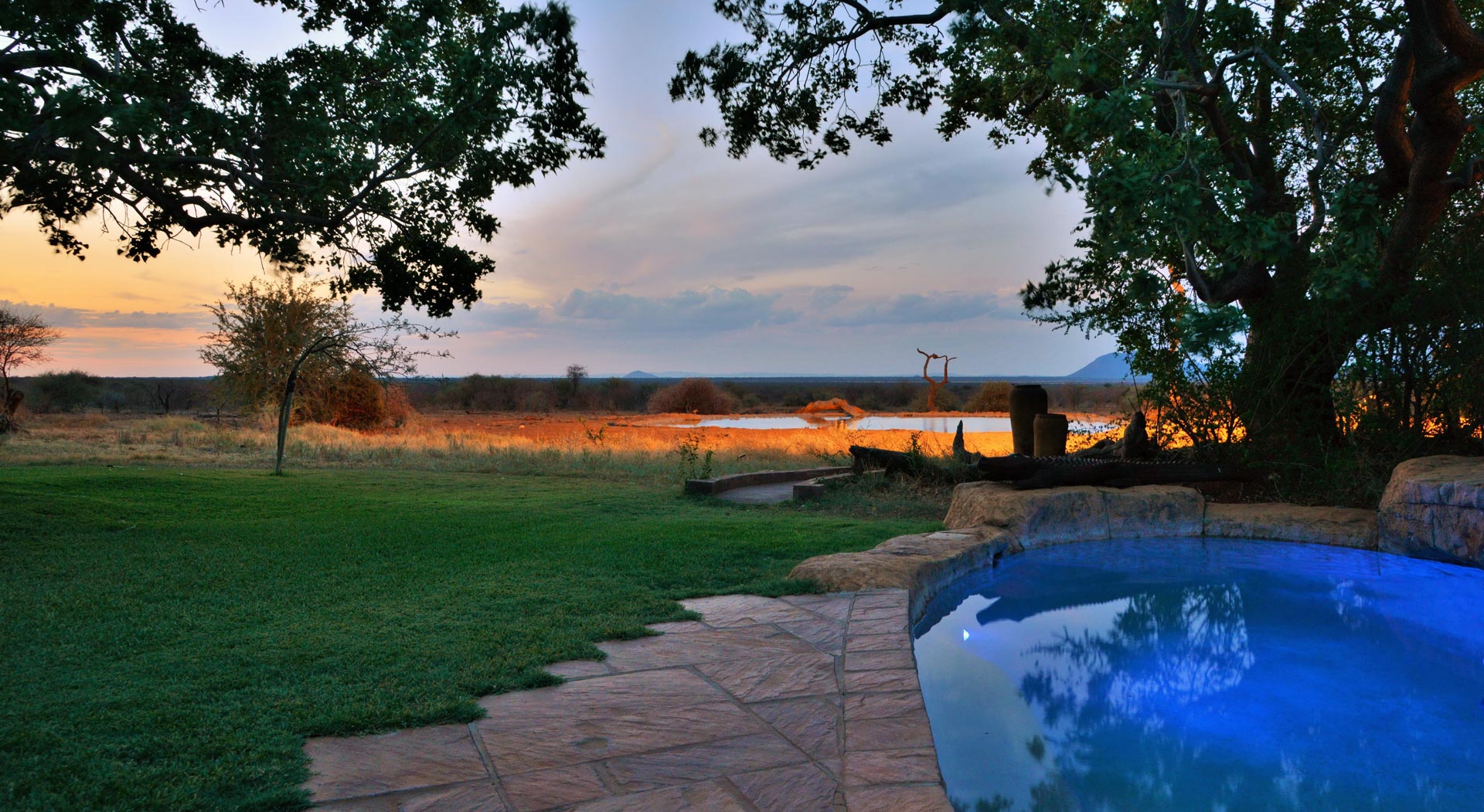 the pool and the waterhole at sunset