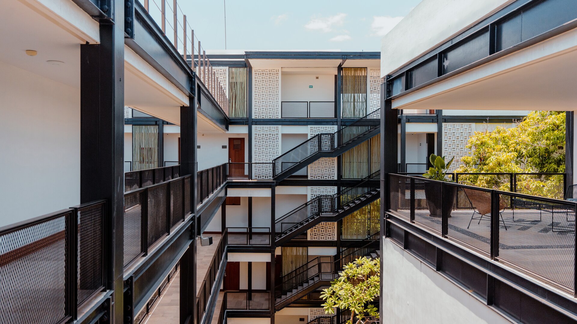 Interior Courtyard and Exterior View of Accommodation Entrances