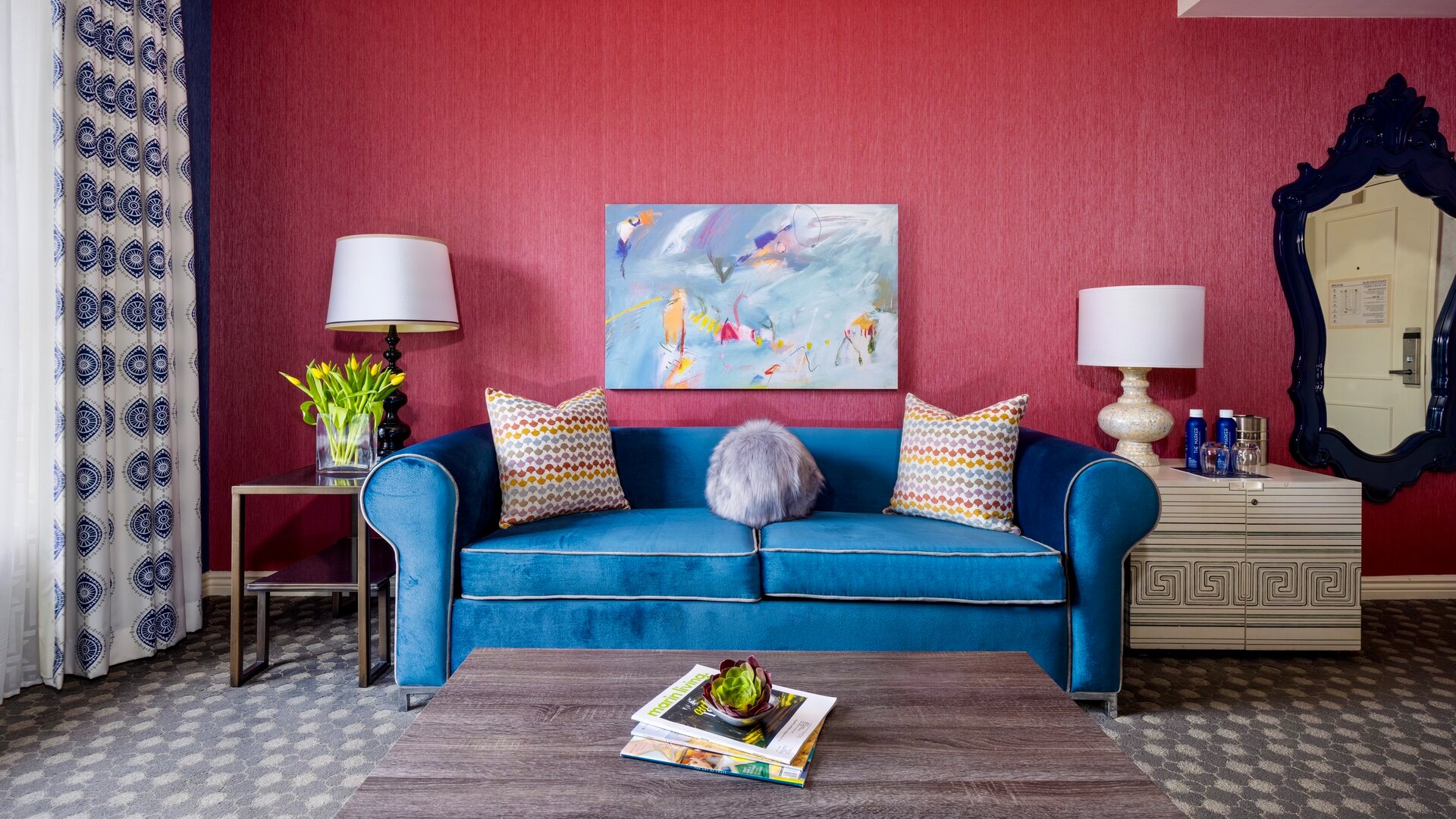 One Bedroom Suite Blue Sofa with Brick-red Wall