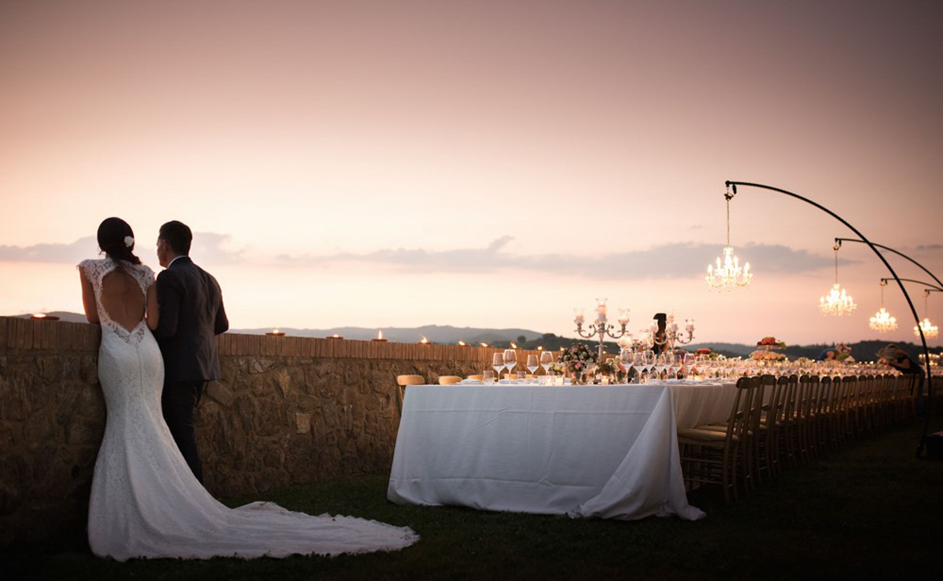 Couple Next to Wedding Table at Sunset