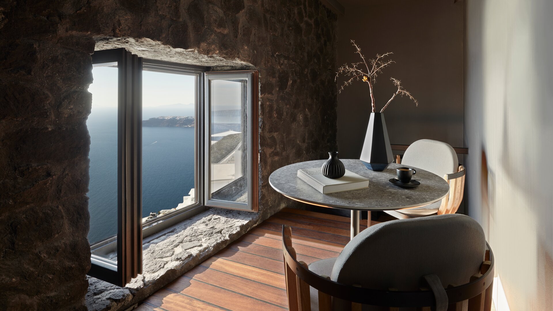 Deluxe Suite Sunset View with Hot Tub | Seating area by Window with Sea View