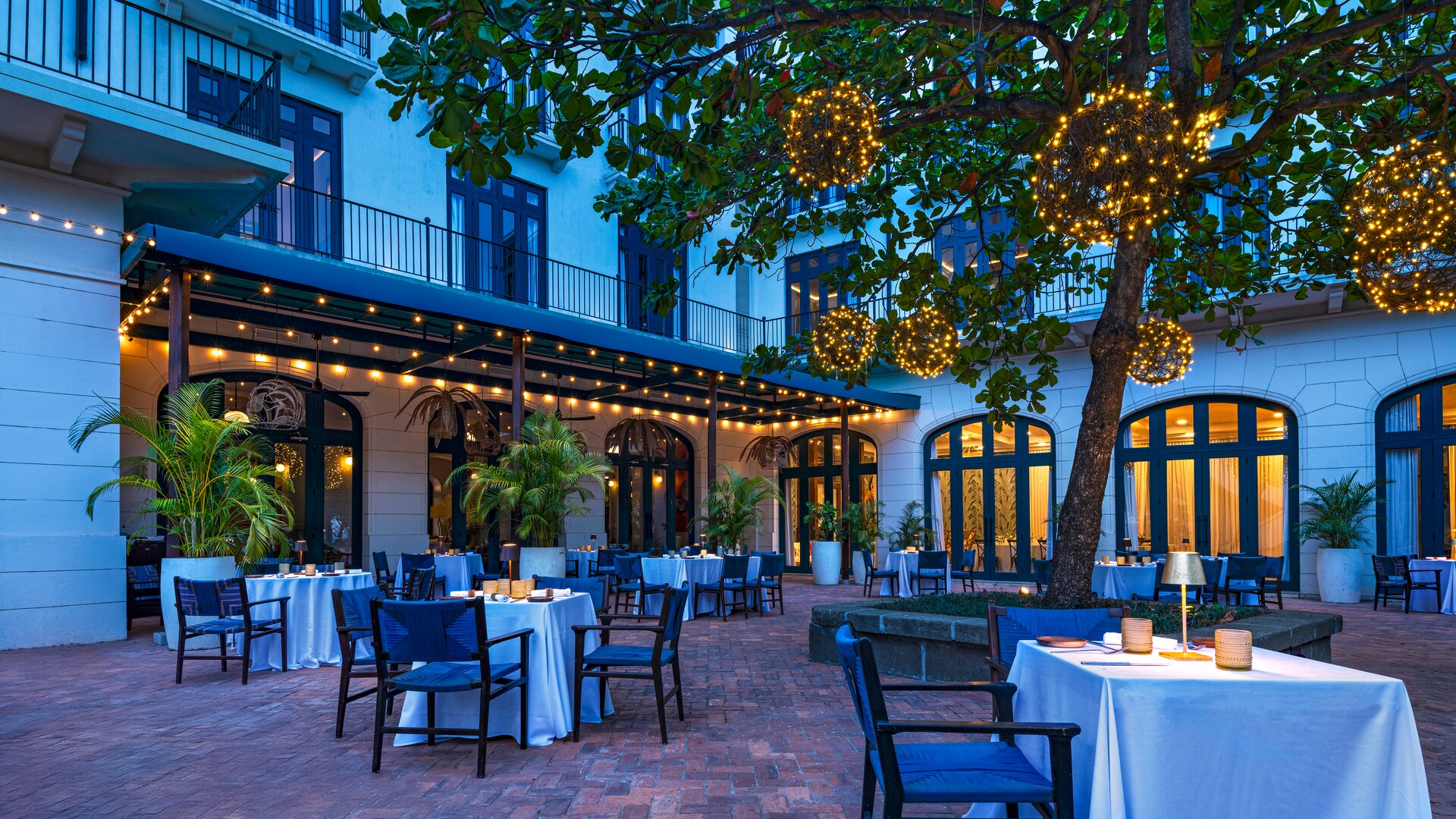 Ponciana Restaurant Courtyard Dining View to Trees and Ocean