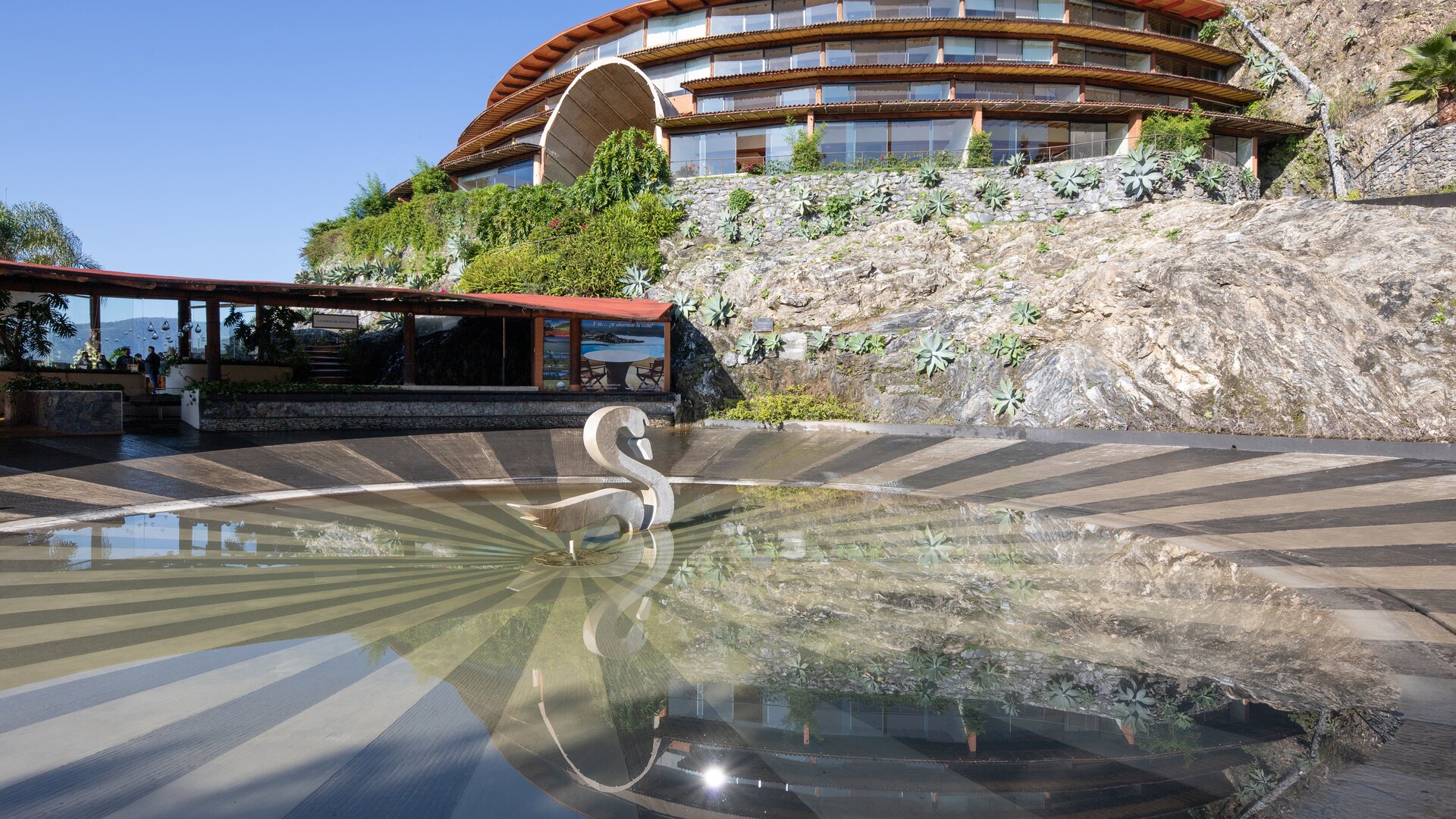Fountain of the Swan and Exterior View of El Santuario Resort & Spa