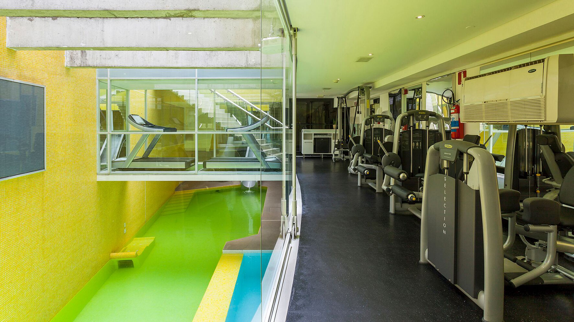 Gym with View to Indoor Pool