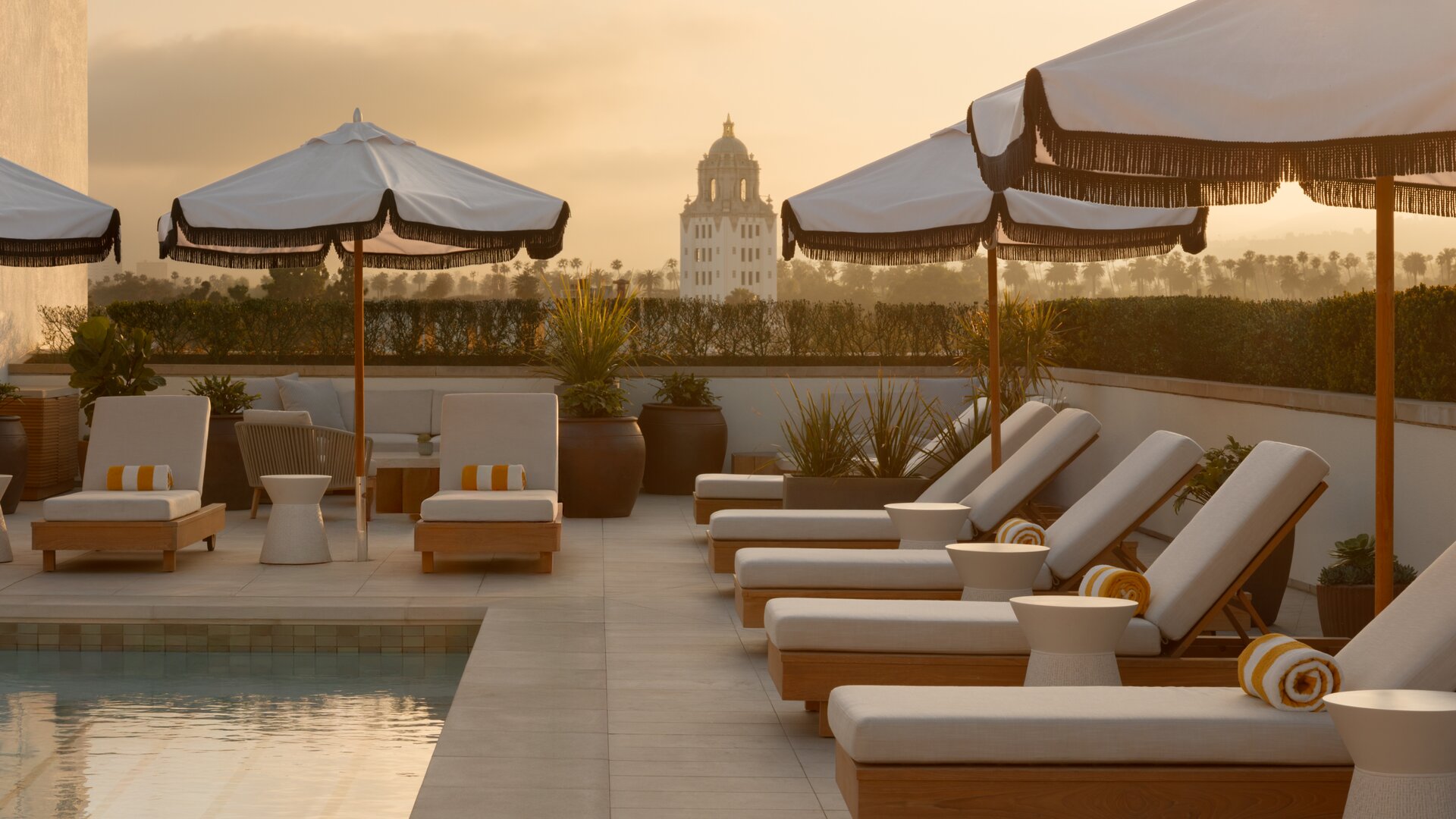 Rooftop Pool and Lounge Chairs at Sunset
