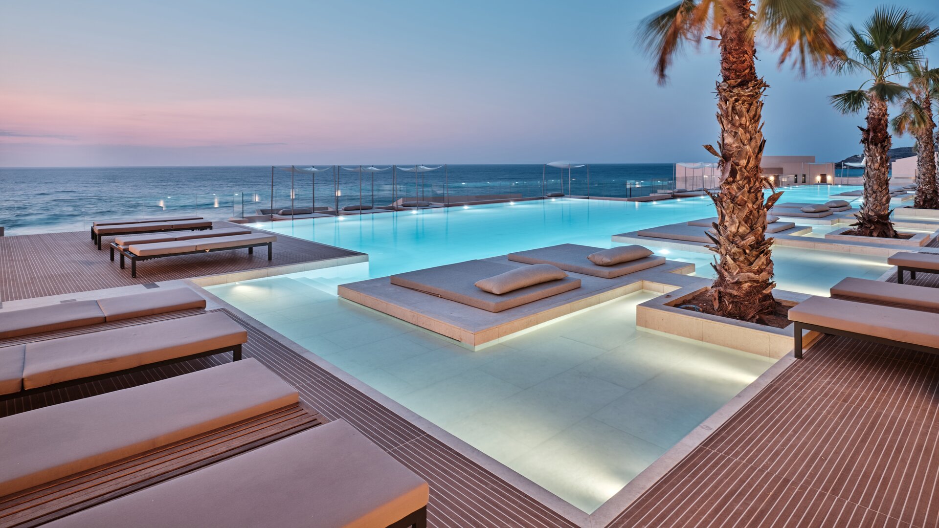 Outdoor Pool by the Sea at Sunset
