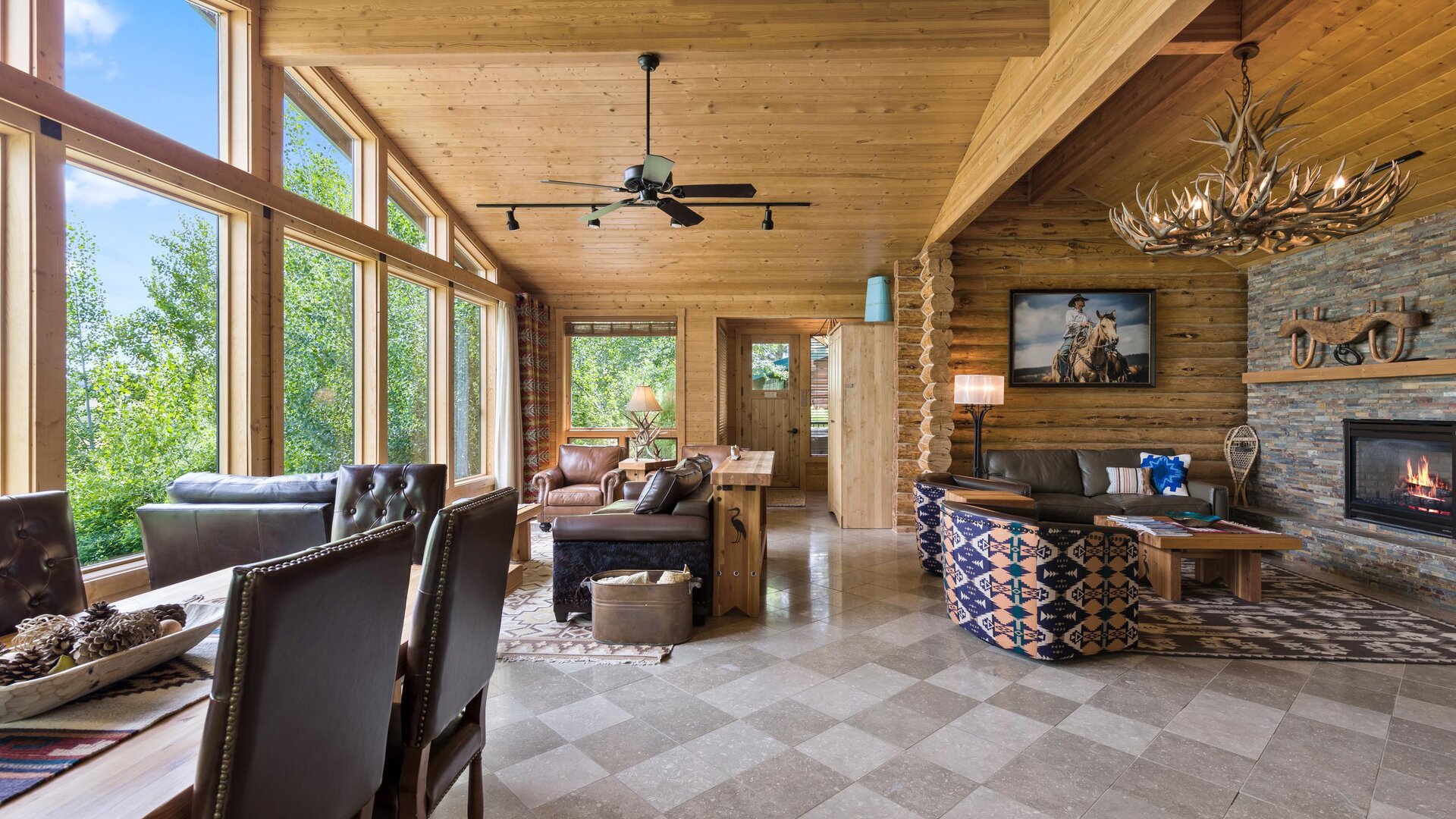 Lakeside Log Cabin Dining, Living, and Fireplace Spaces