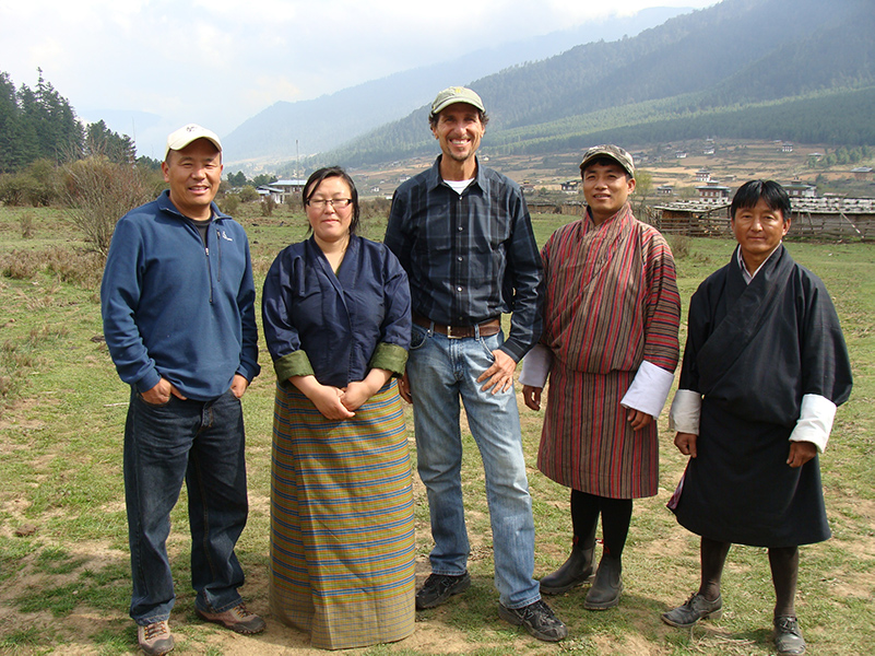 Christ connecting with local community members in Bhutan's Phobjikha Valley.