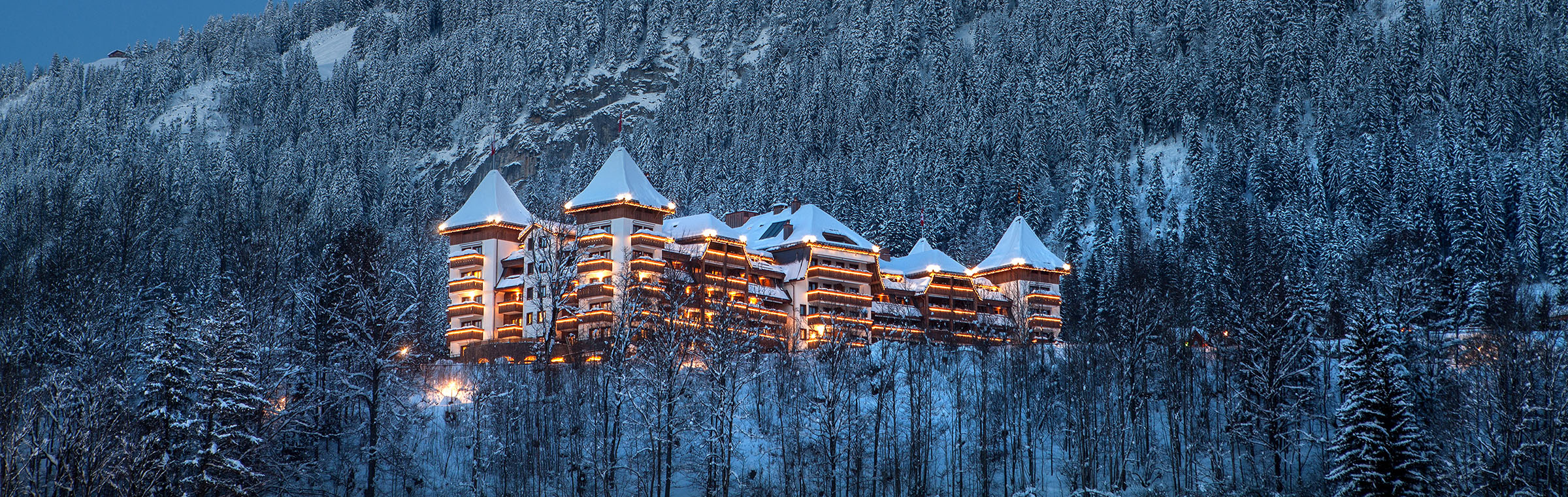 The Alpina Gstaad Exterior at Dusk