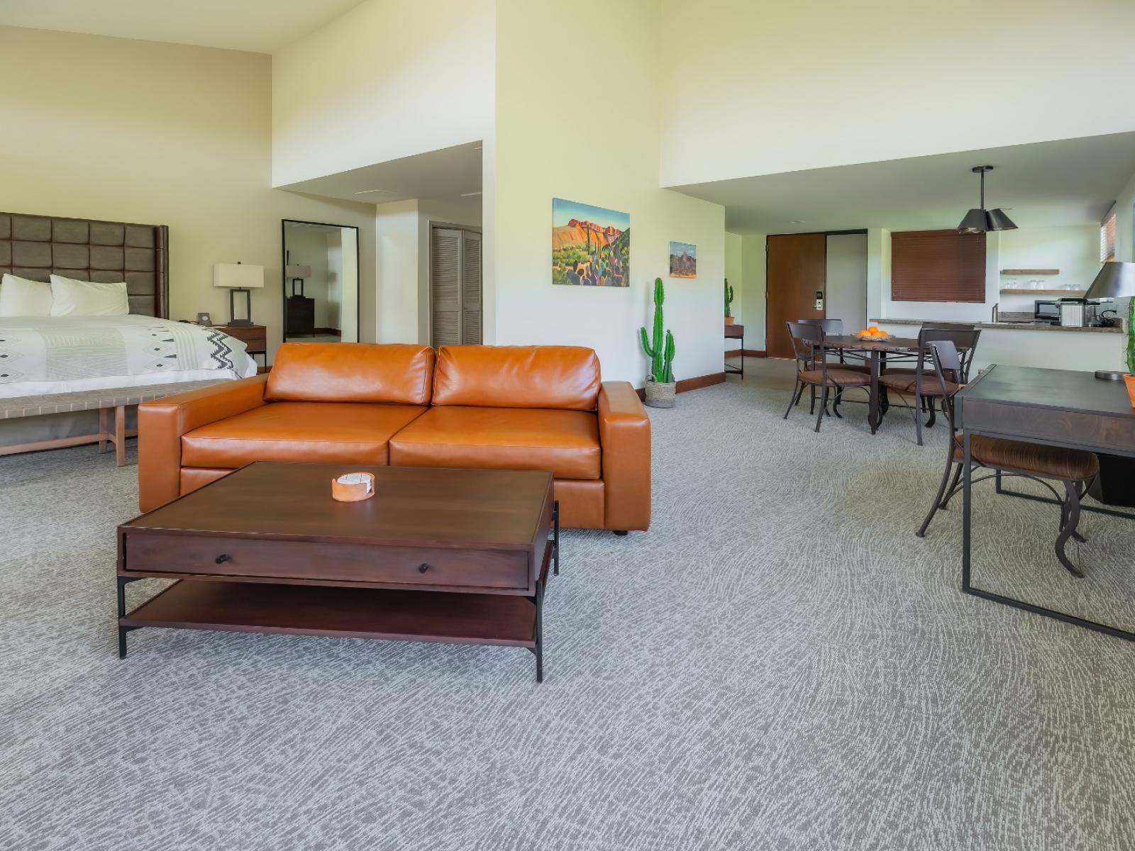 The King Bed suite at Ventana Canyon Club and Lodge showing the bed and seating area.