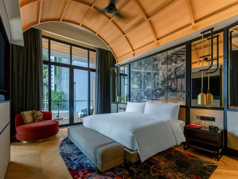 Terrace Suite Bedroom with partial garden view