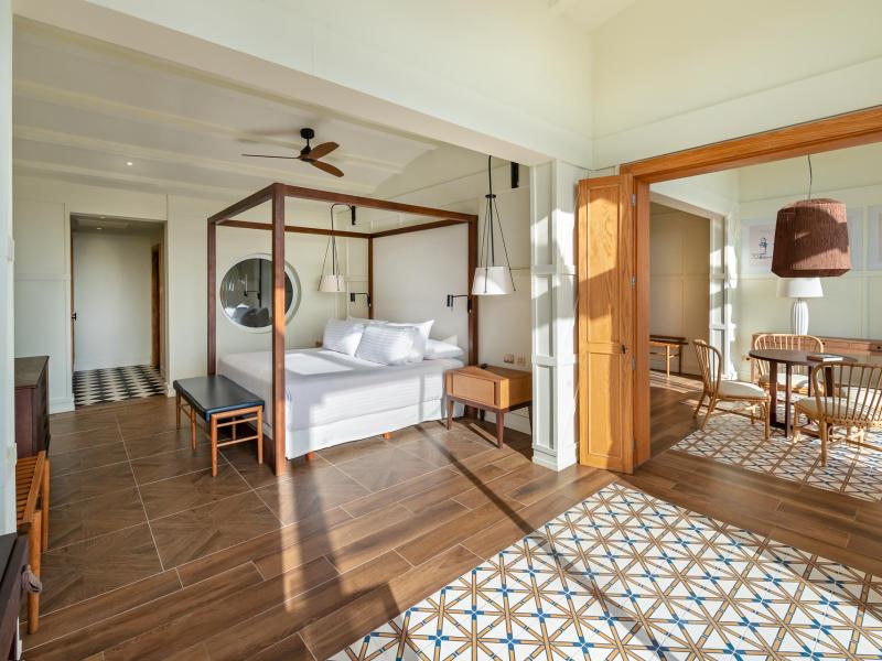 Privilege Royal Master Suite Ocean View Bed and Dining Room