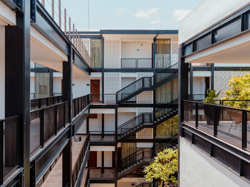 Interior Courtyard and Exterior View of Accommodation Entrances