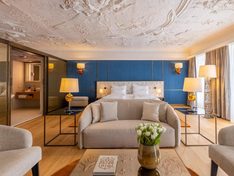 Honeymoon Suite Portrait View with Living Area in the Forefront and Bed in the Background