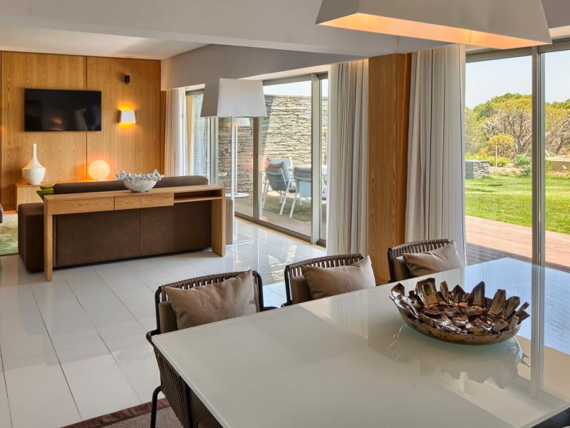 Grand Deluxe Suite with Garden View Living and Dining Area
