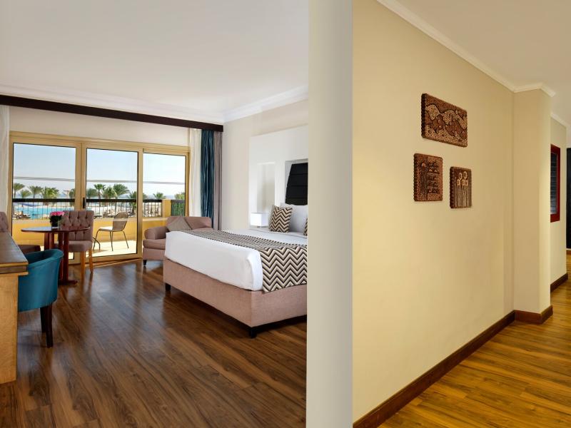 Comfort and style in a Family Suite with elegant wood flooring and a welcoming living space.