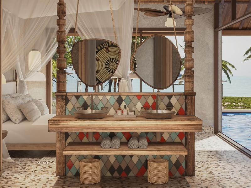 Signature Villa chic interior featuring a rustic wooden double vanity with colorful diamond-patterned tiles, complemented by soft beige tones and ocean views.