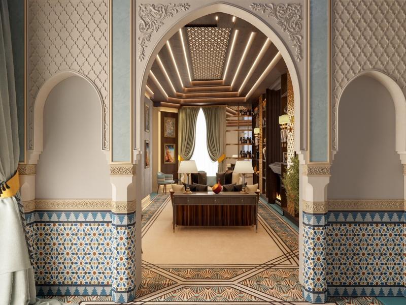 Gran Claridge Suite stunning archway with intricate geometric patterns and blue-and-gold mosaic accents leading into a luxurious seating area with soft beige tones.