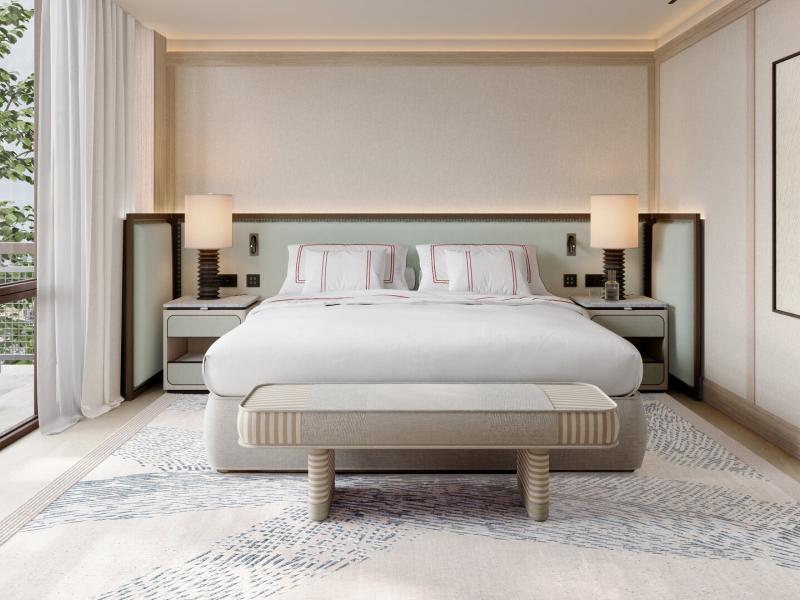 A serene luxury guest room at Hotel Miramar Barcelona showcases a plush upholstered bed, soft layered linens, and symmetrical nightstands, accented by warm ivory, sand beige, and subtle taupe tones.