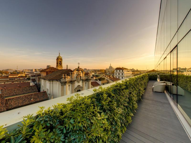 Terrace with greenery and city views at Armani Hotel Milano