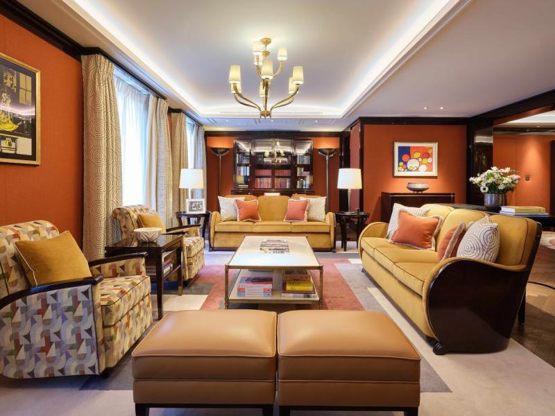 Grand and artfully composed suite living room designed for entertaining, where refined furnishings meet the timeless spirit of the 1920s.