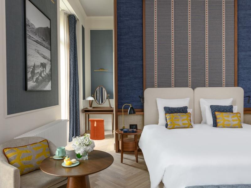 Traveller Deluxe Room featuring contemporary furnishings, refined textiles, and a calm, sophisticated atmosphere designed for modern comfort.