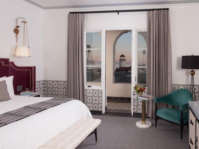Guestrooms with private balconies and coastal views.