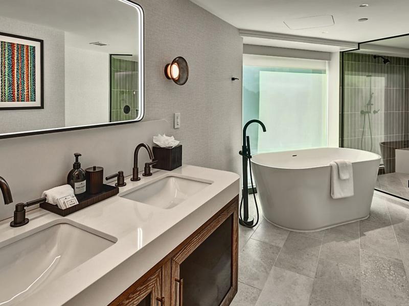 A spacious spa-inspired bathroom with upscale finishes designed for comfort and relaxation.