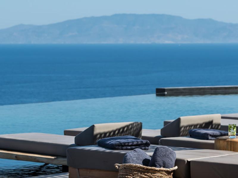Andronis Arcadia Ocean View Lounging at Infinity Pool