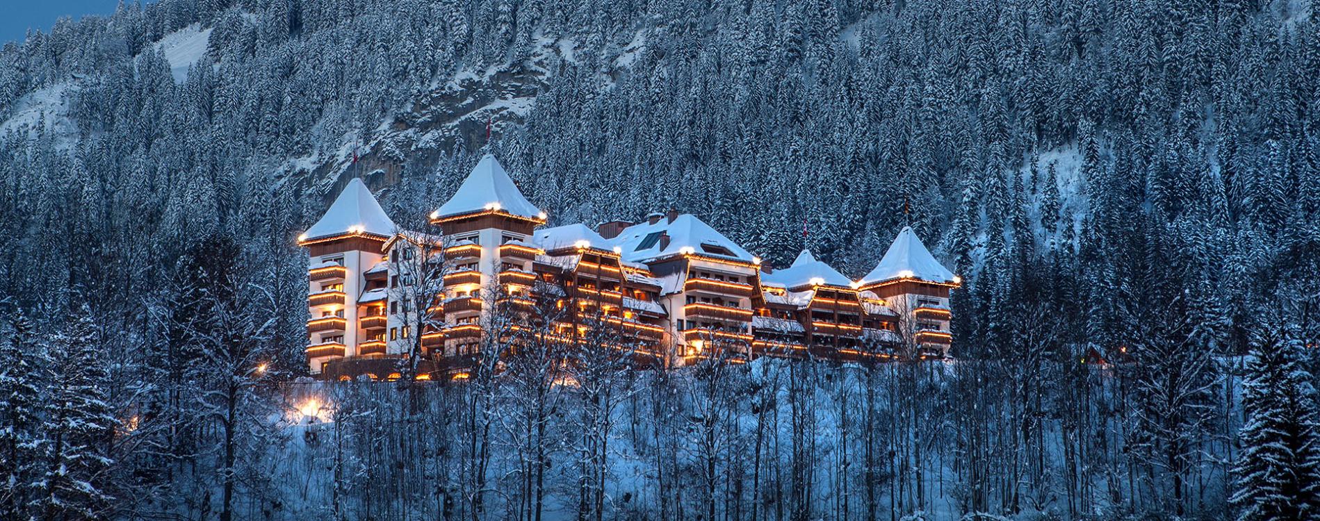 The Alpina Gstaad Exterior at Dusk