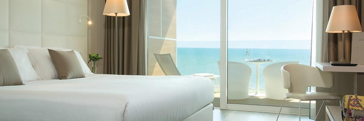 room accommodations featuring room service setting on tray in front of wall with back lit mirrored television