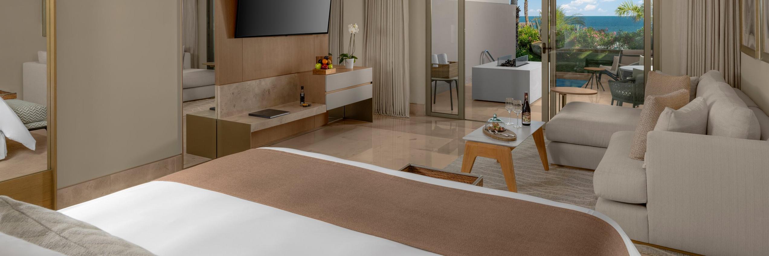 Grand Velas Boutique Los Cabos | Pool King Suite Bedroom View to Private Terrace