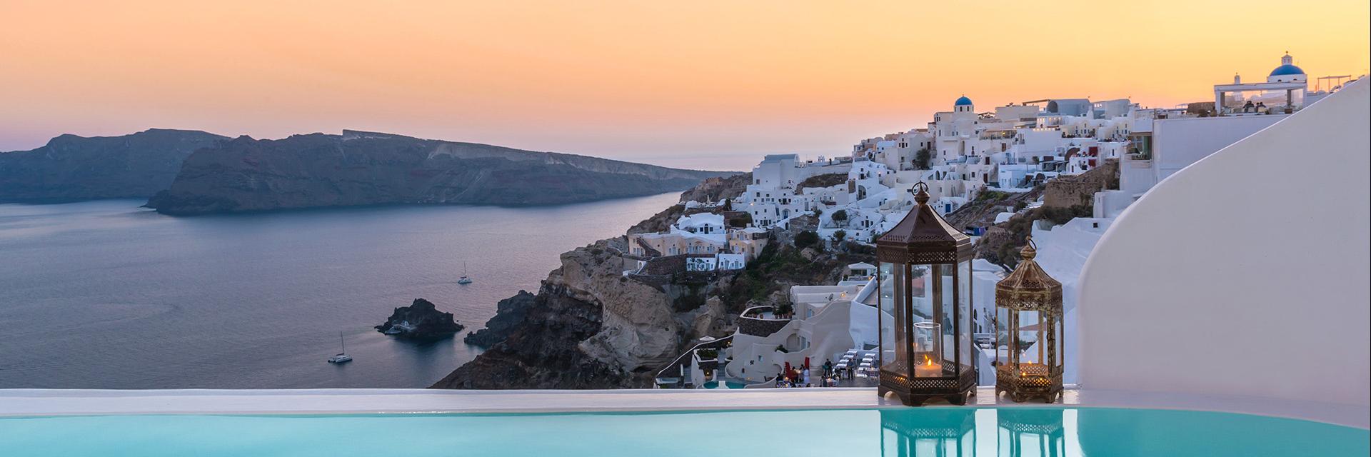 Andronis Luxury Suites Rooftop Pool Overlooking Ocean and White and Blue Houses