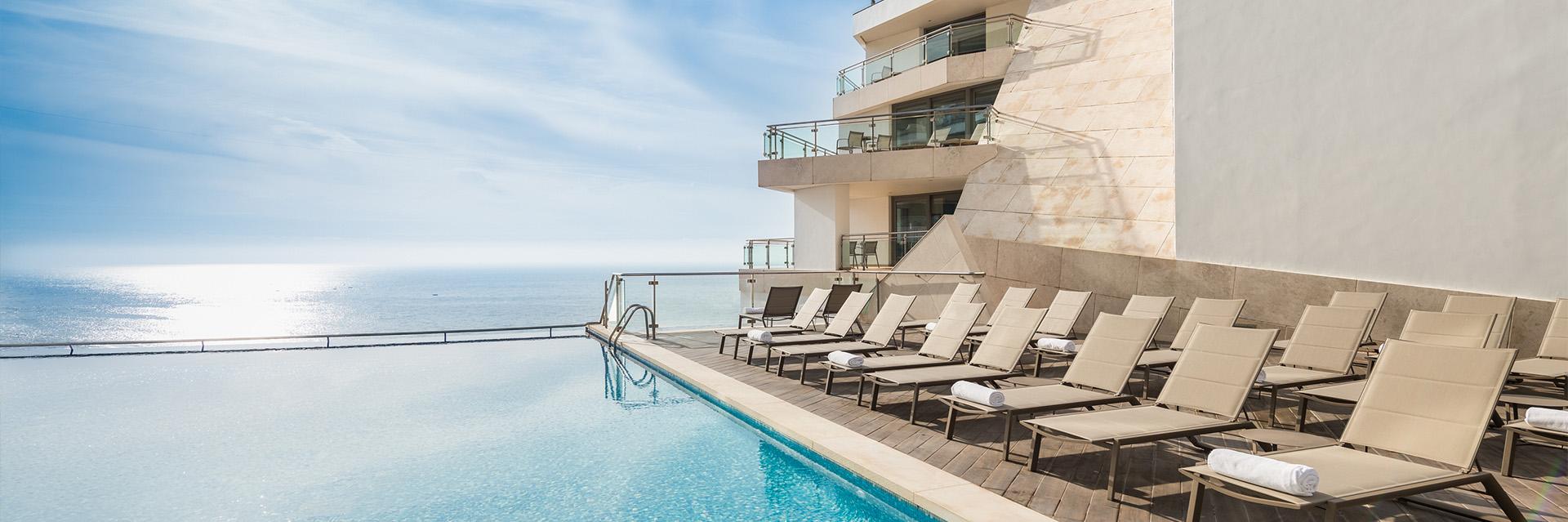 Sesimbra Oceanfront Hotel Pool and Loungers