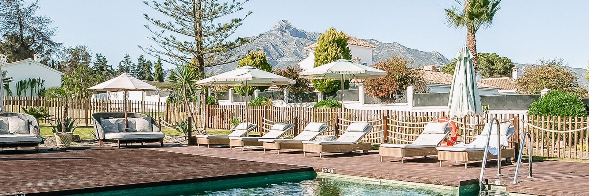 BOHO Club Marbella Poolside Lounging View of Water and Mountains