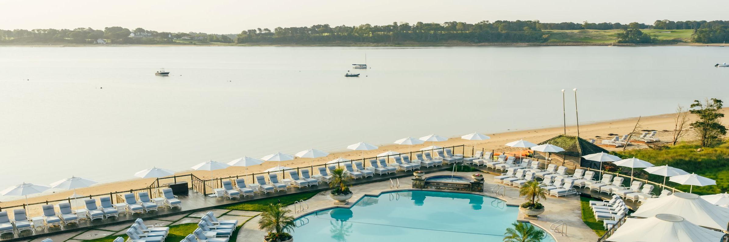 Wequassett Resort and Golf Club Waterview and Pool with loungers and cabanas, Boats on Water Sailing