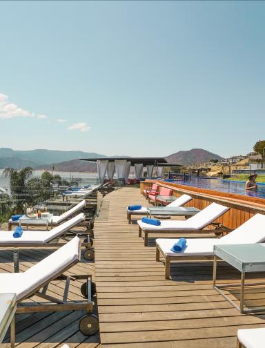 El Santuario Resort & Spa Pool with Loungers and view of Sea