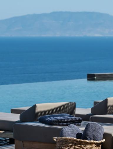 Andronis Arcadia Ocean View Lounging at Infinity Pool