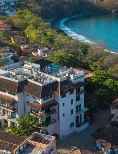 Santarena Hotel | Exterior Aerial View with Nearby Sea Coast