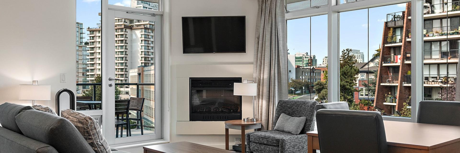 The Parkside Hotel & Spa Guest Accommodations Living Room with large windows and terrace