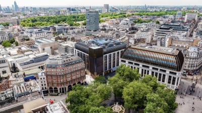 An aerial view of The Londoner, and London city in the background.