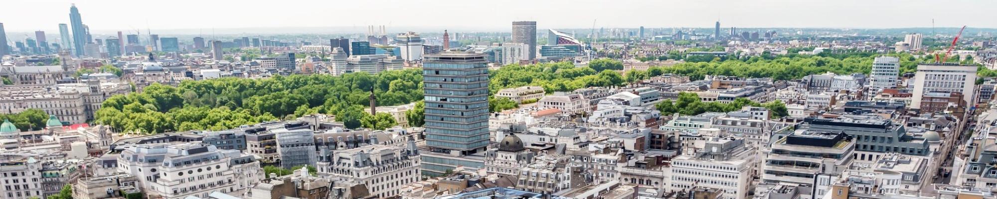 An aerial view of The Londoner, and London city in the background.